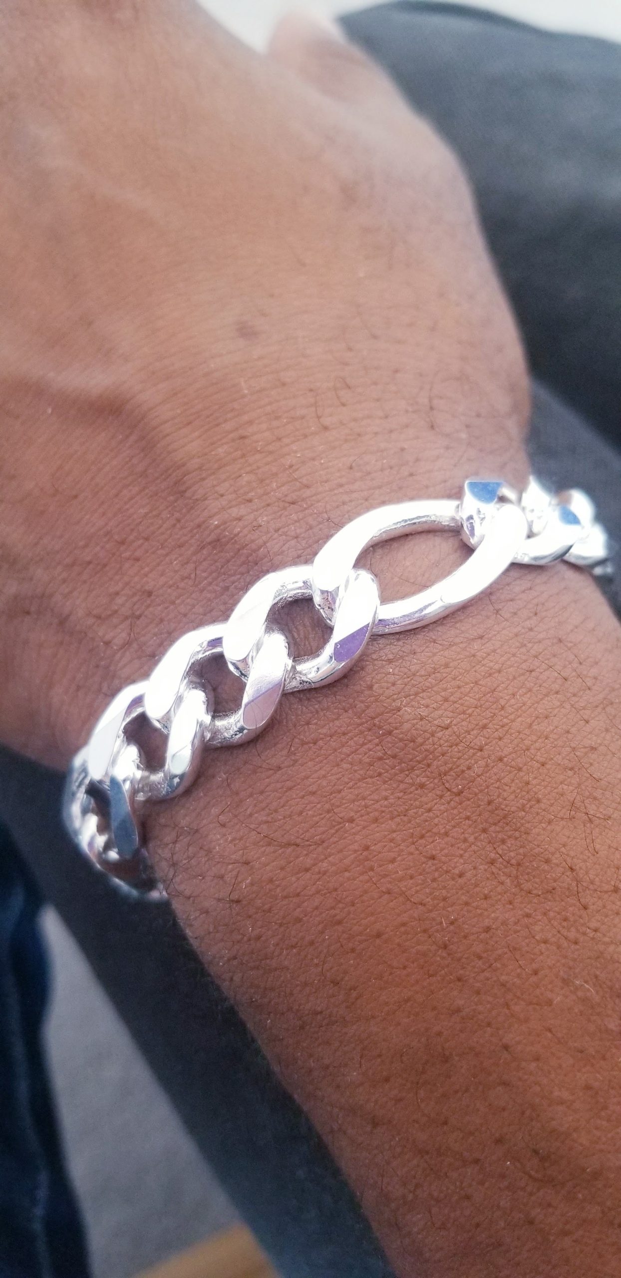 Bracelet Figaro 13mm 8.5 inches.jpg on mans wrist