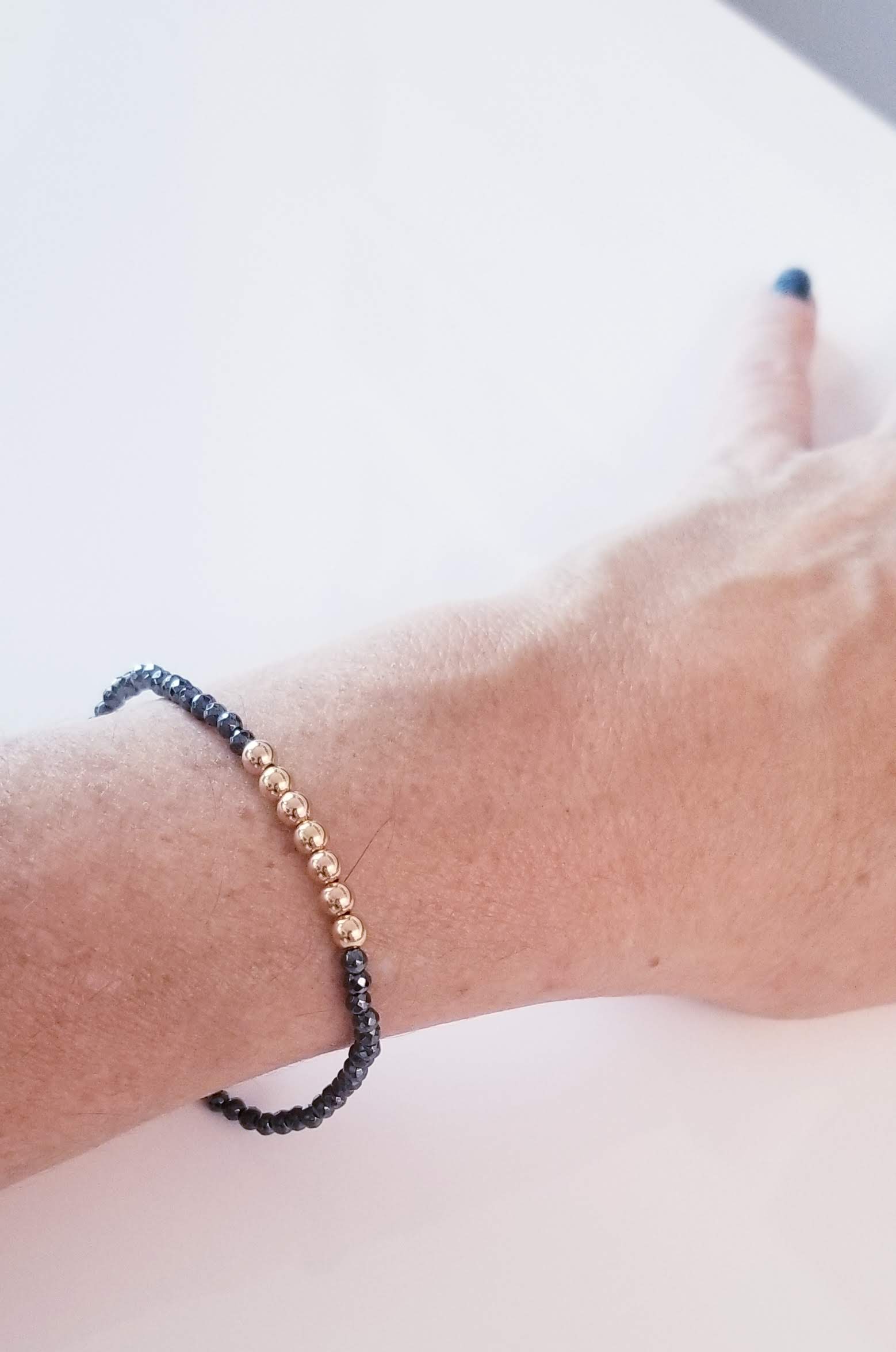 bracelet hematite gold plated silver on elastic.jpg 2